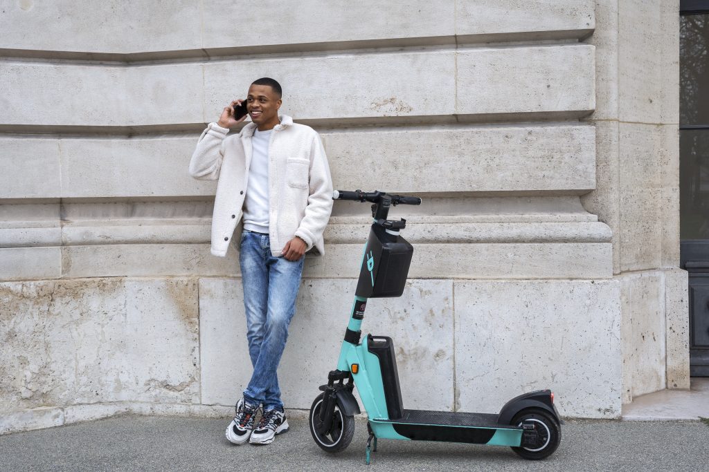 person using electric scooter city