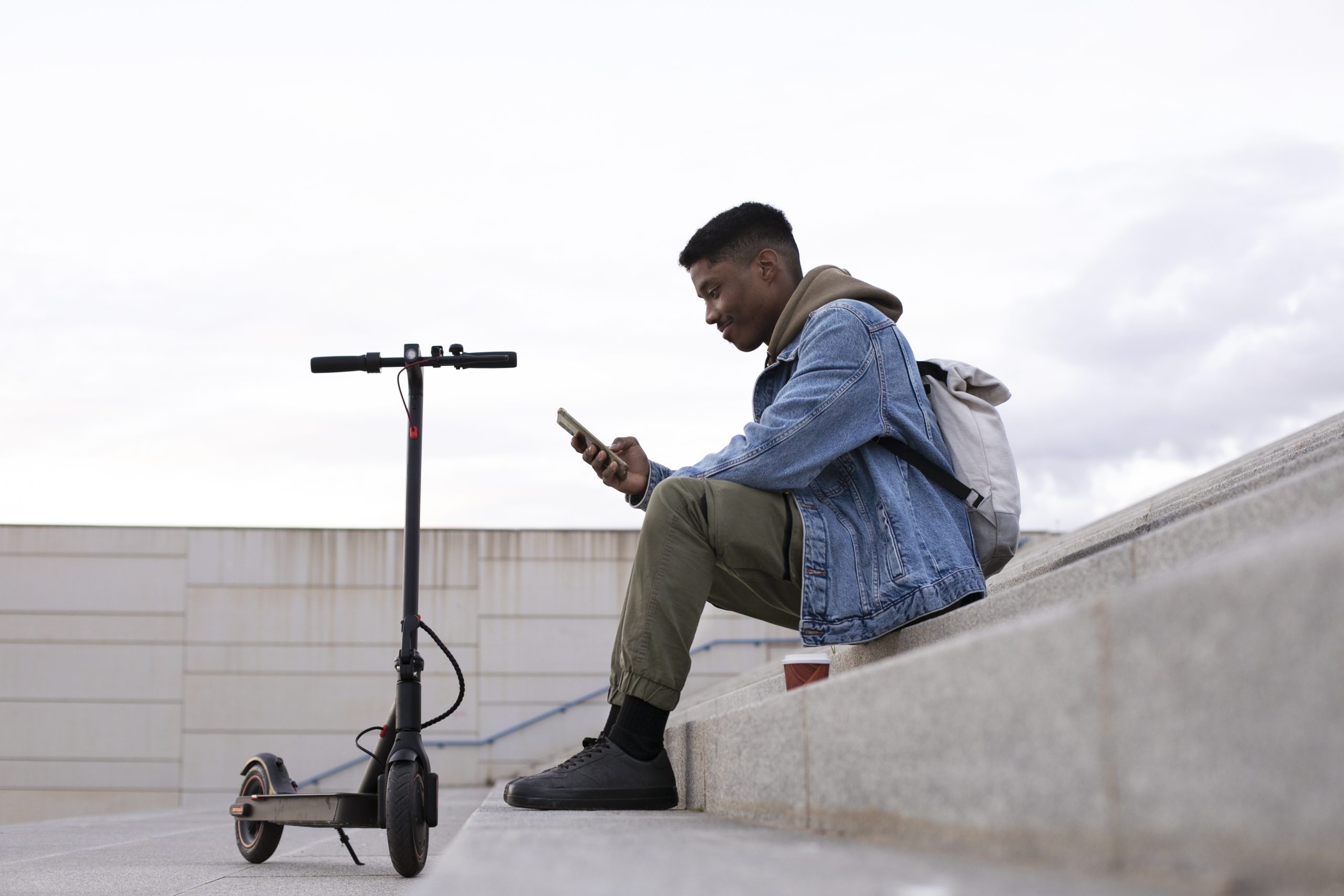 young adult using electric scooter transportation